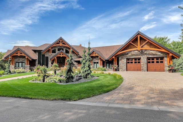 view of front of home featuring a garage and a front yard