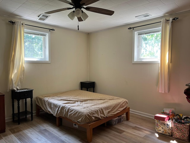 bedroom featuring ceiling fan and light wood-type flooring