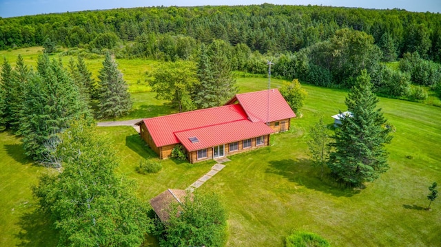 aerial view featuring a wooded view