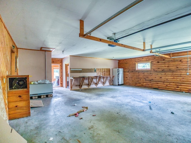 garage with freestanding refrigerator