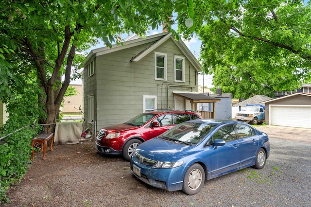 view of front of house featuring an outdoor structure and a garage