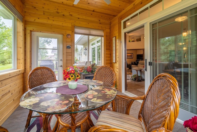 sunroom with wooden ceiling and a healthy amount of sunlight