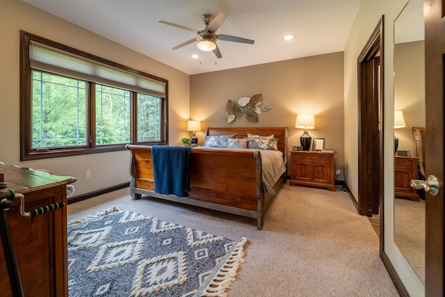 bedroom with baseboards, recessed lighting, a ceiling fan, and light colored carpet