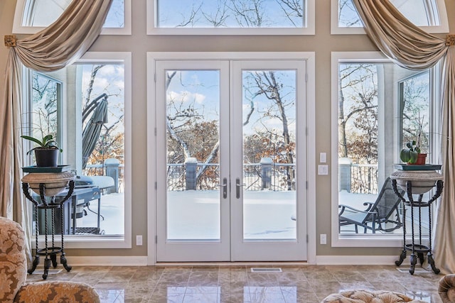 entryway featuring a healthy amount of sunlight and french doors