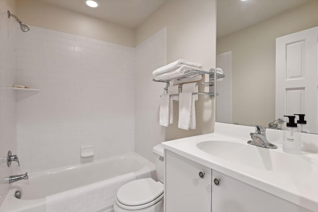 full bathroom featuring vanity, toilet, and tiled shower / bath