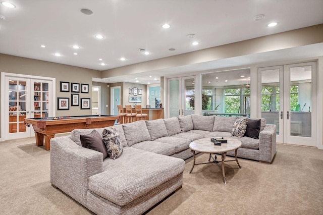 living room with light carpet, pool table, and french doors