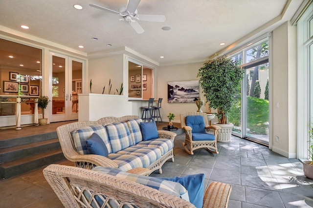 living room with ceiling fan and french doors