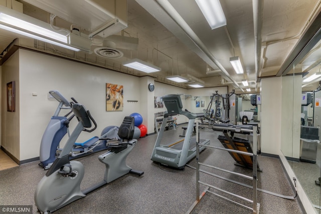 workout area featuring baseboards and visible vents