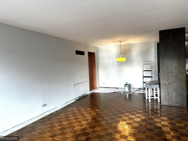 spare room with a textured ceiling