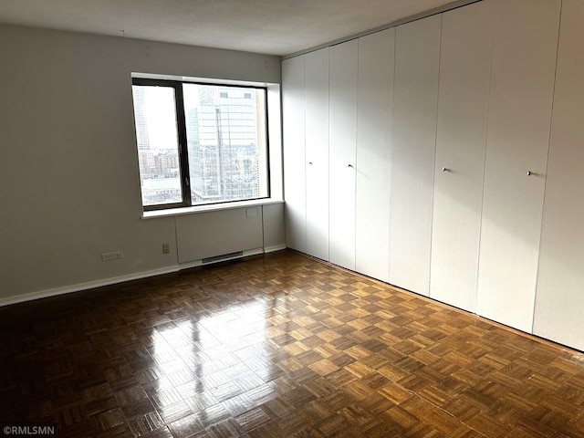 unfurnished bedroom featuring baseboards