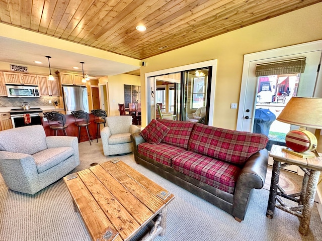 living room featuring light colored carpet and wooden ceiling