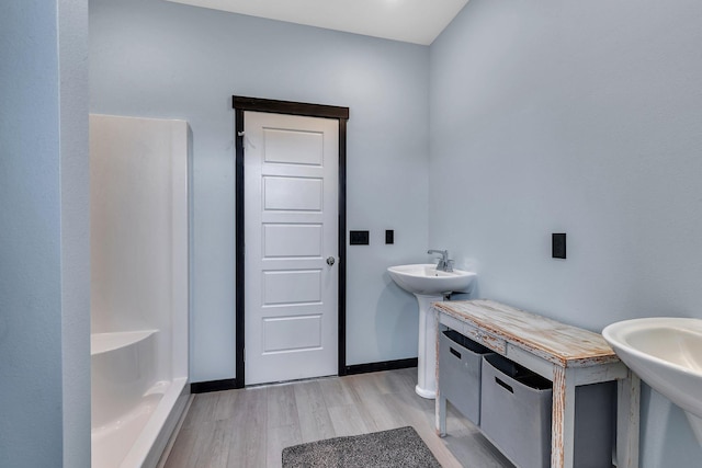 bathroom featuring sink and hardwood / wood-style floors