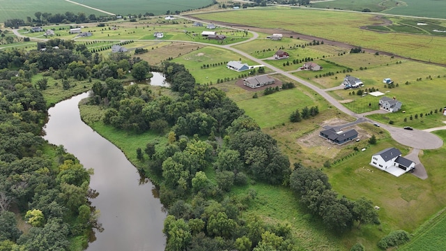 aerial view featuring a rural view and a water view