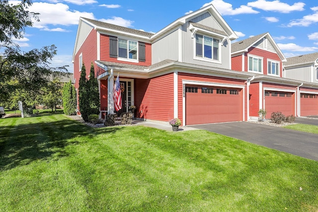 view of front of property with a garage and a front yard