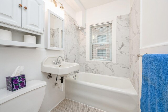 79 Western Ave N Unit 205, Saint Paul, MN 55102 - bathroom featuring toilet, tile patterned floors, and washtub / shower combination