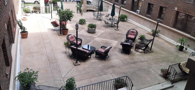 79 Western Ave N Unit 205, Saint Paul, MN 55102 - view of patio with an outdoor hangout area, cooling unit, and outdoor dining area