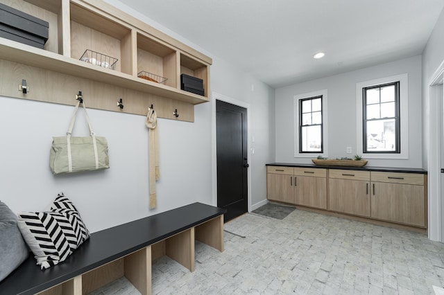 mudroom with recessed lighting and baseboards