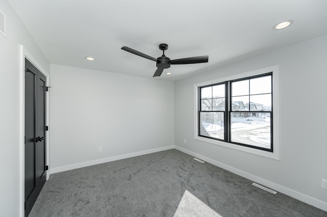 spare room featuring recessed lighting, carpet flooring, ceiling fan, and baseboards