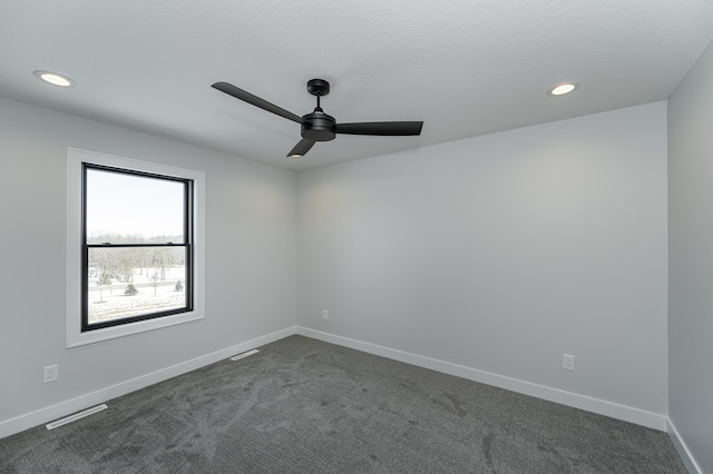 empty room with visible vents, baseboards, recessed lighting, a ceiling fan, and dark colored carpet