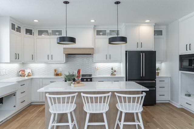 2643 Timber Oaks Rd SW, Rochester, MN 55902 - kitchen featuring high end refrigerator, built in microwave, light wood-type flooring, light countertops, and recessed lighting