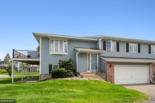 split foyer home with a garage and a front lawn