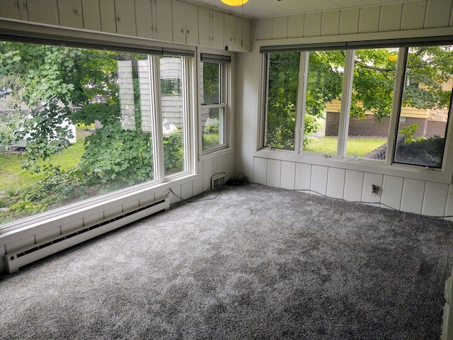 unfurnished sunroom with a baseboard radiator