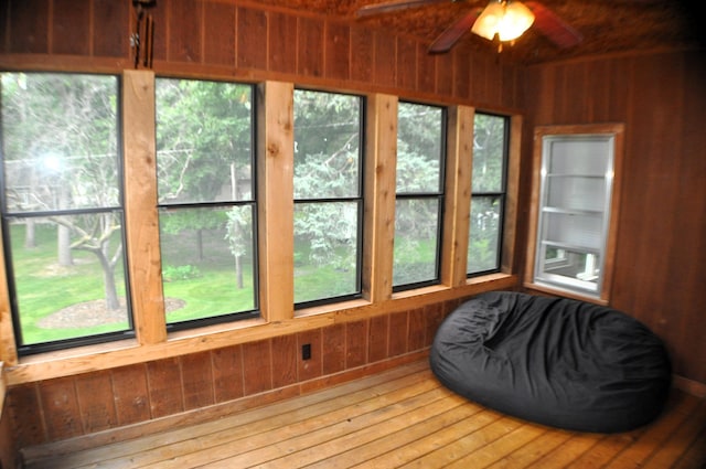 sunroom / solarium with ceiling fan and a wealth of natural light