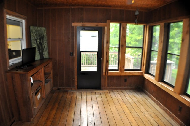 unfurnished sunroom with a wealth of natural light