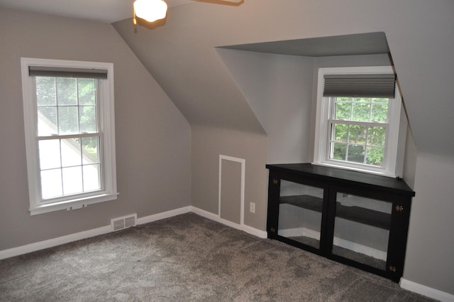 bonus room with carpet, lofted ceiling, and ceiling fan