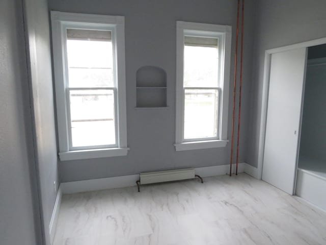 empty room with a baseboard heating unit