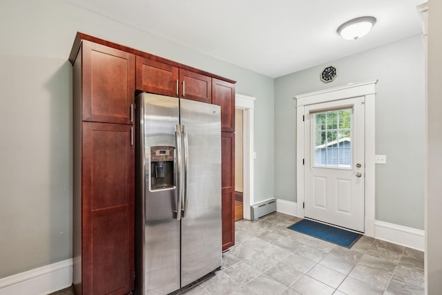 kitchen with stainless steel fridge with ice dispenser and light tile patterned floors