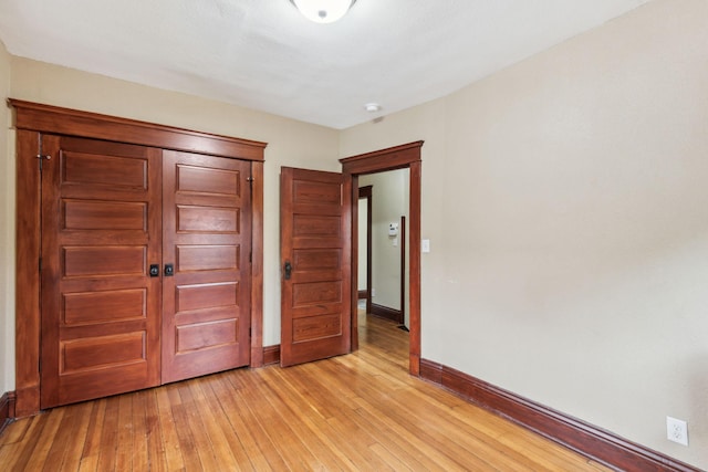 unfurnished bedroom with light hardwood / wood-style floors