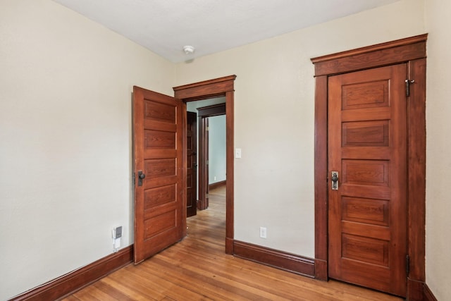 spare room featuring light hardwood / wood-style floors