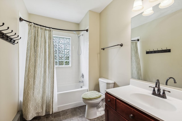 full bathroom featuring tile patterned flooring, shower / bath combo, toilet, and vanity