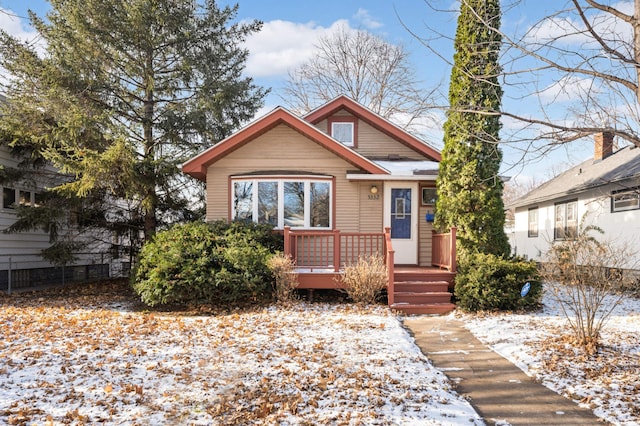 bungalow-style house featuring a wooden deck