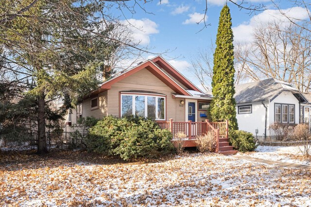 bungalow-style house featuring a wooden deck