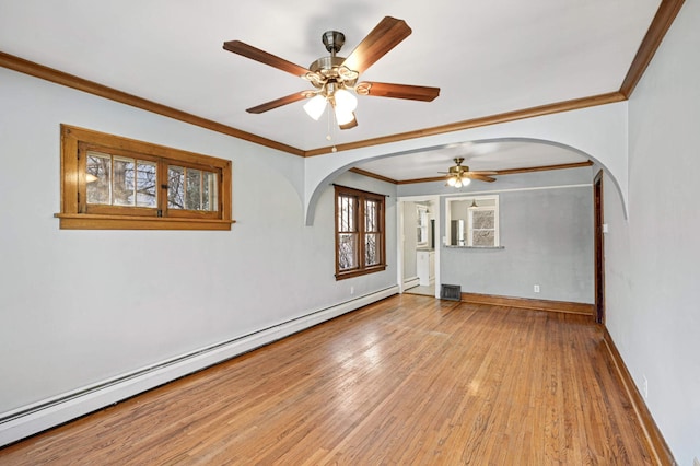 empty room with ceiling fan, ornamental molding, a baseboard radiator, and light hardwood / wood-style floors