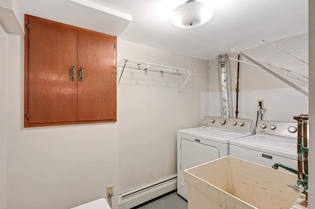 laundry room with separate washer and dryer, sink, and a baseboard radiator