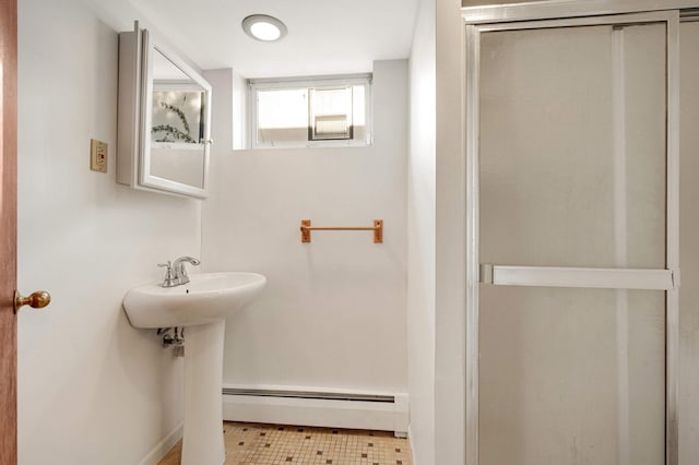 bathroom featuring tile patterned flooring and a baseboard radiator