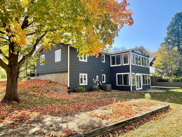 back of house featuring central AC