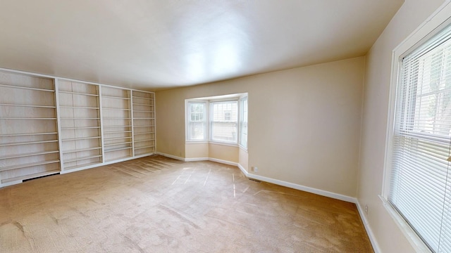 empty room with light colored carpet