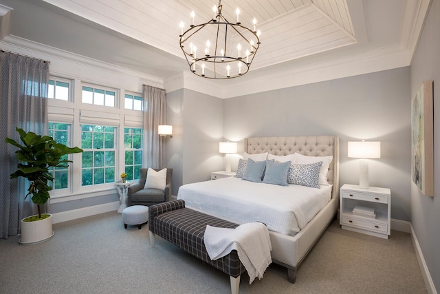 carpeted bedroom with a raised ceiling, a chandelier, and ornamental molding