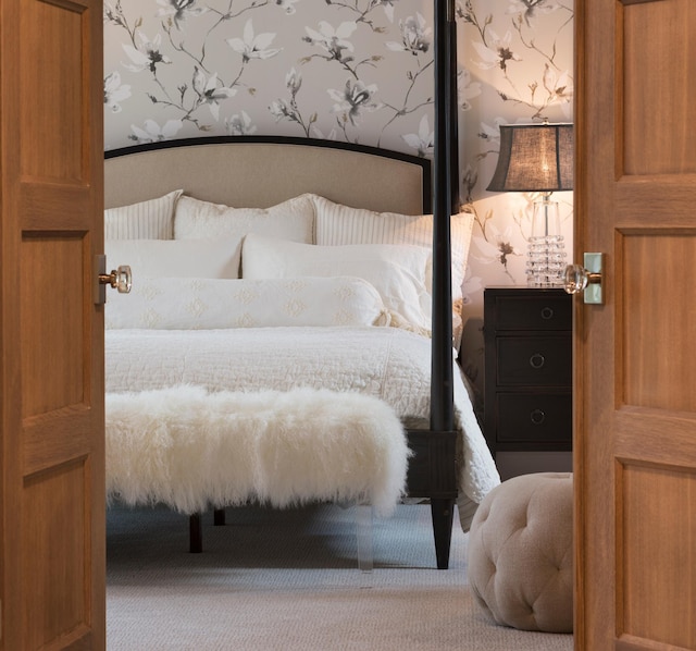 bedroom featuring carpet flooring and wallpapered walls