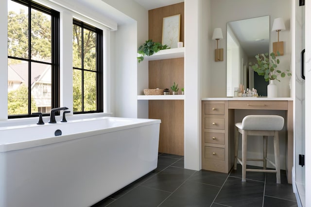 bathroom with plenty of natural light, tile patterned flooring, and vanity