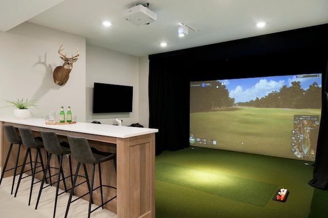 recreation room with carpet and golf simulator