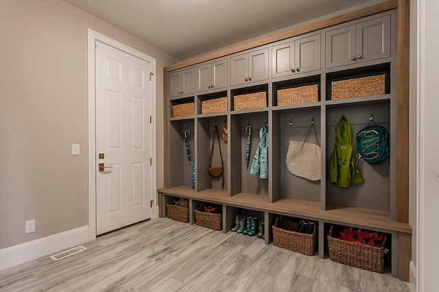 mudroom with light hardwood / wood-style floors