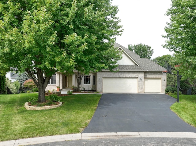 obstructed view of property with a garage and a front yard