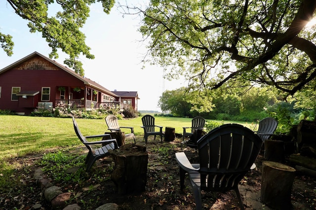 view of yard with an outdoor fire pit and a wooden deck