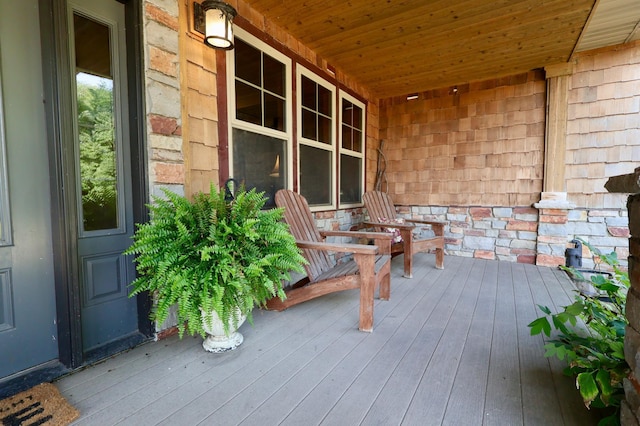 wooden deck featuring covered porch