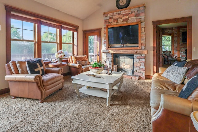 living area featuring a fireplace, vaulted ceiling, and carpet flooring